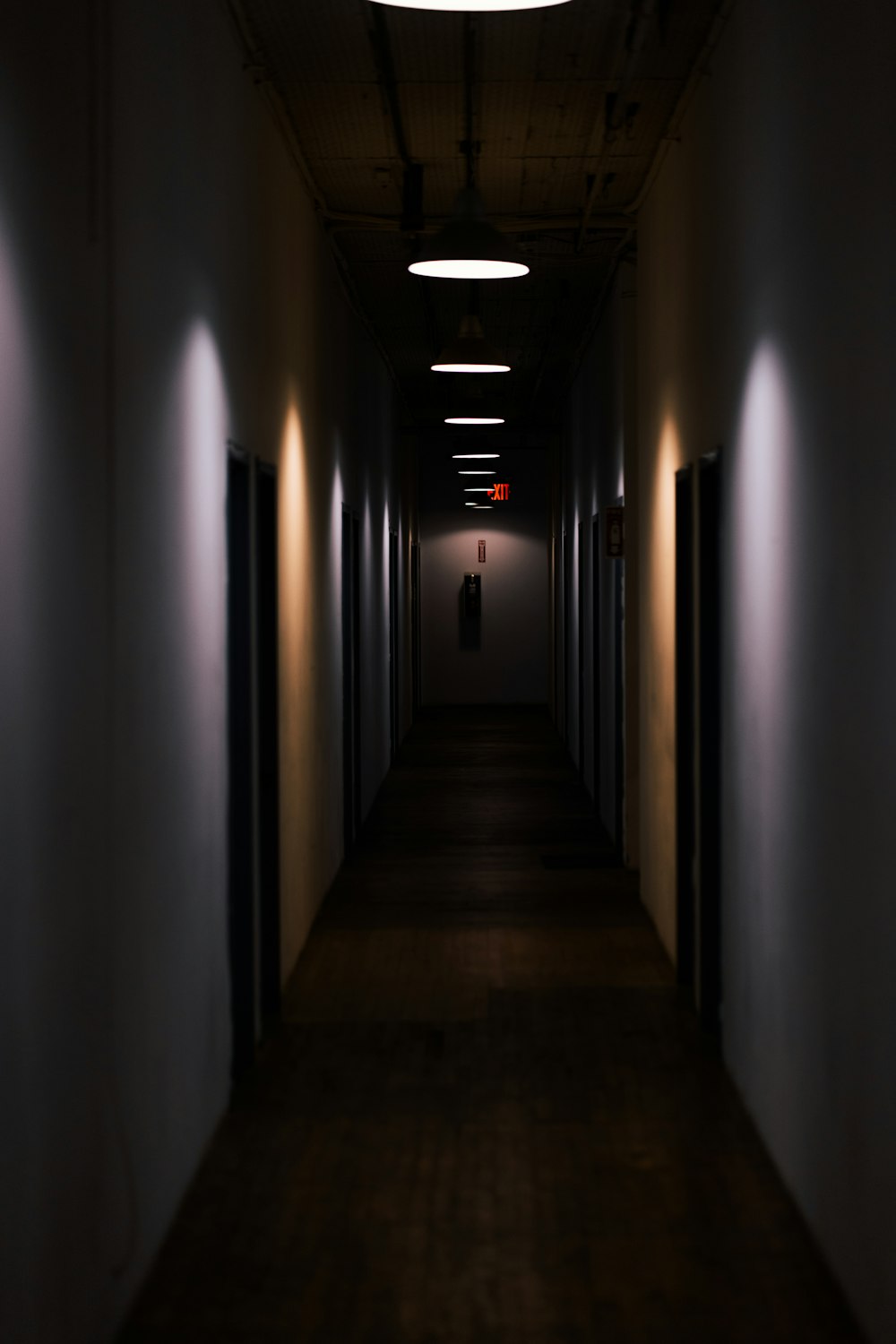 hallway with lights turned on in a hallway