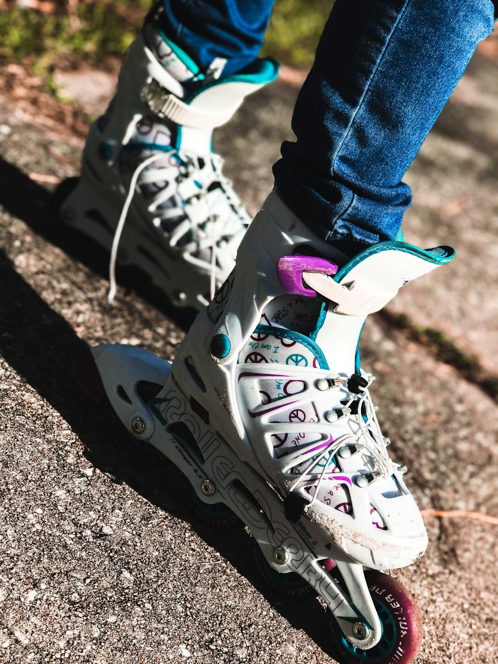 person wearing white and black nike air max 90