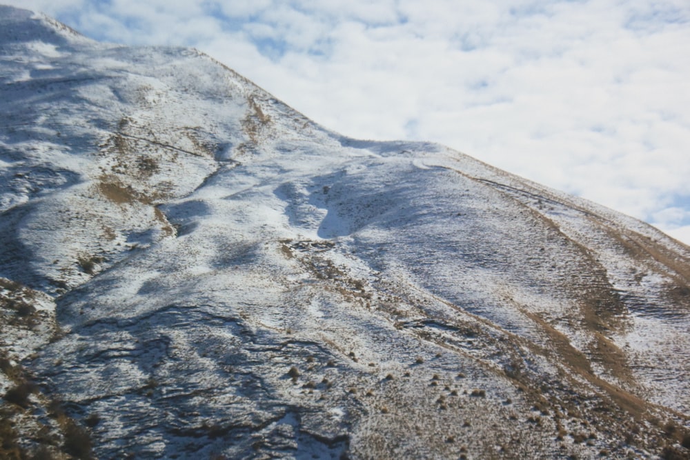 white and gray mountain under white clouds during daytime