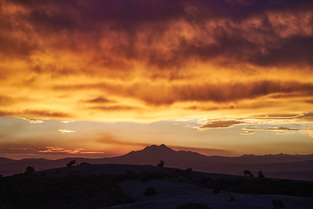 silhouette of mountains during sunset