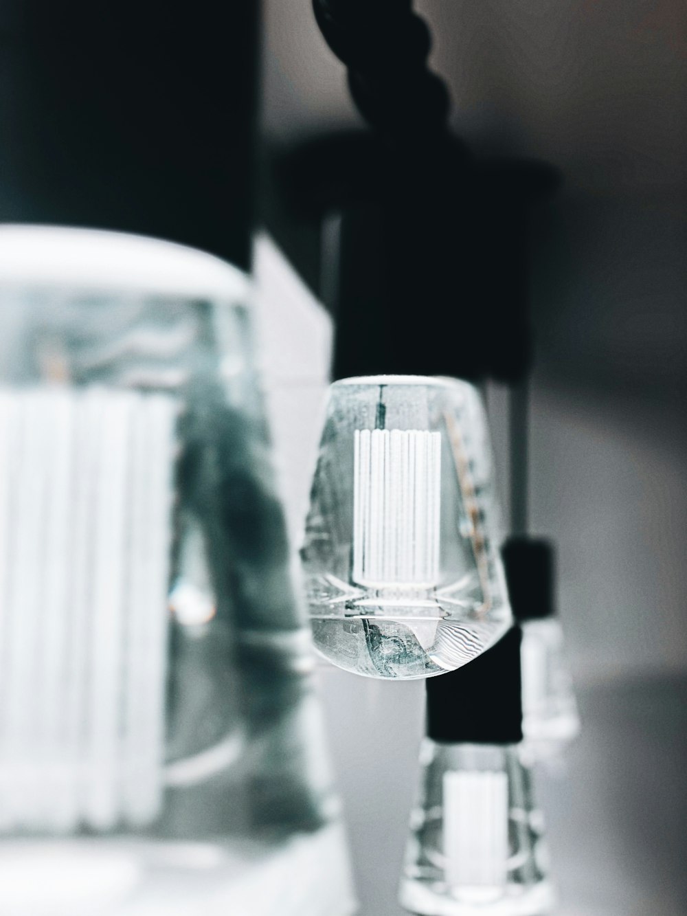 clear glass light bulb turned on in tilt shift lens