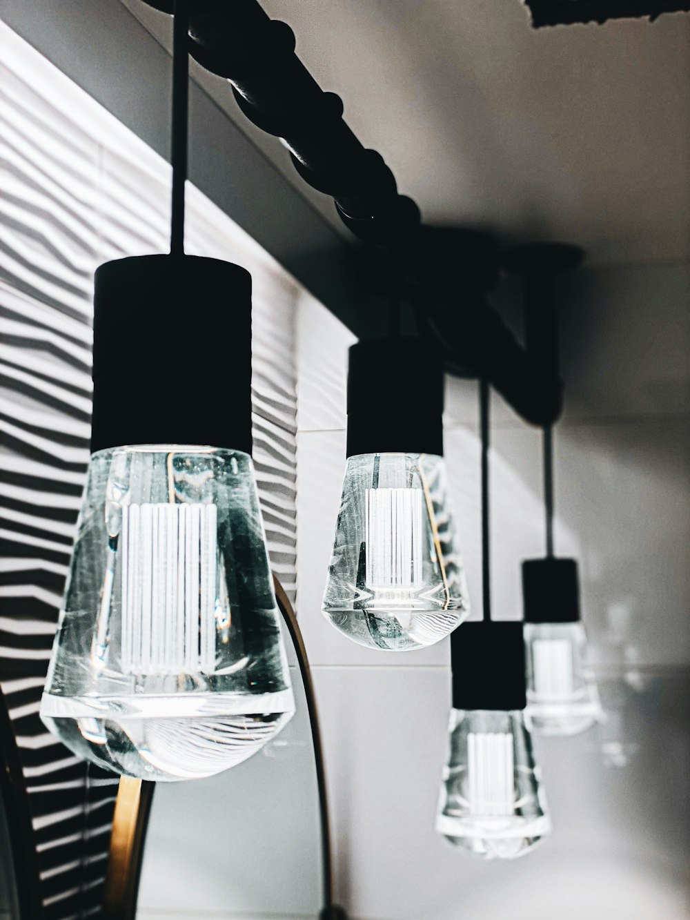 three clear glass light bulbs