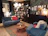 A cozy living room featuring dark and light blue wooden furniture from águanobre.
