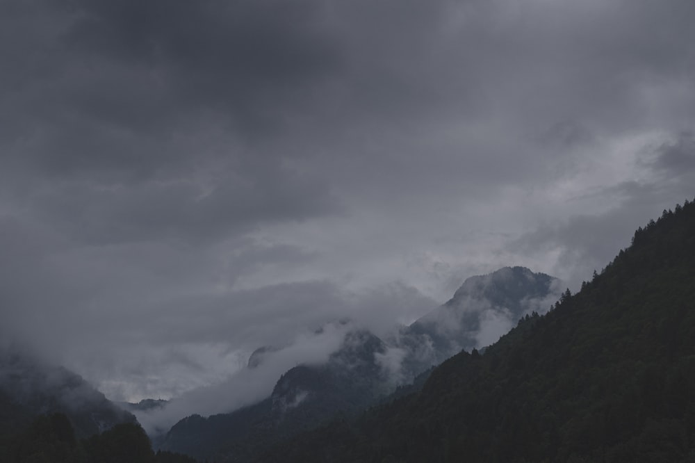 green mountains under white clouds during daytime