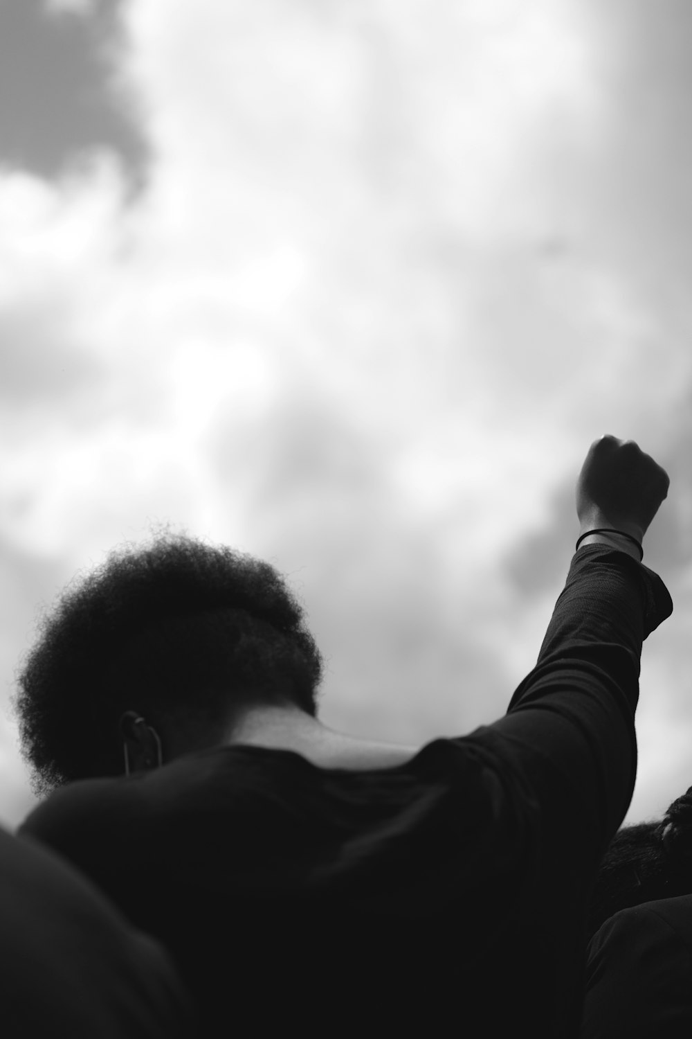 grayscale photo of man in black long sleeve shirt