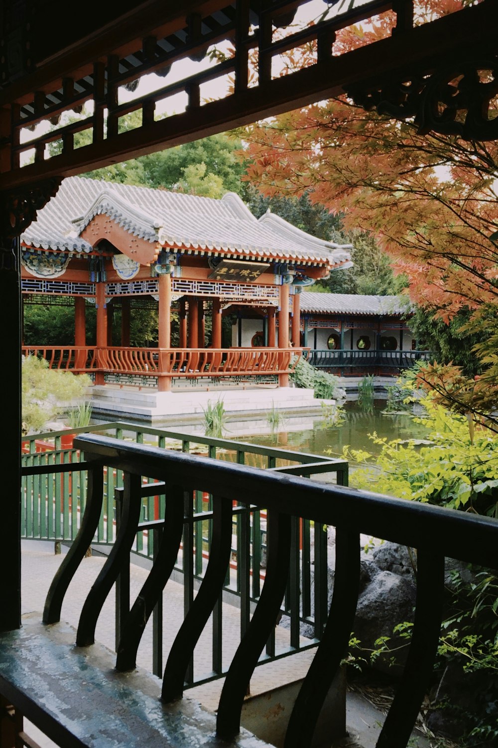 brown wooden gazebo near river during daytime