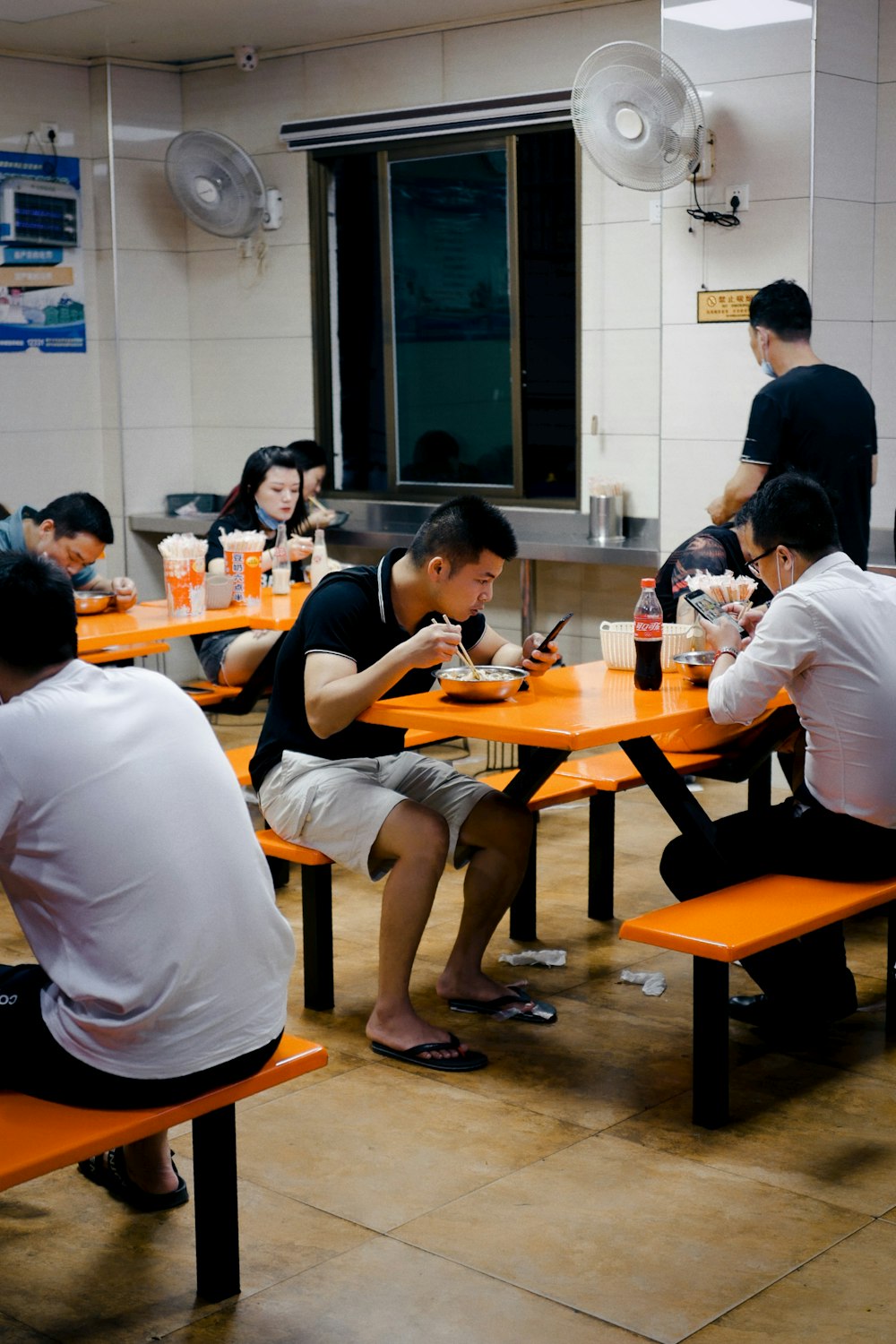 people sitting on chair in front of table