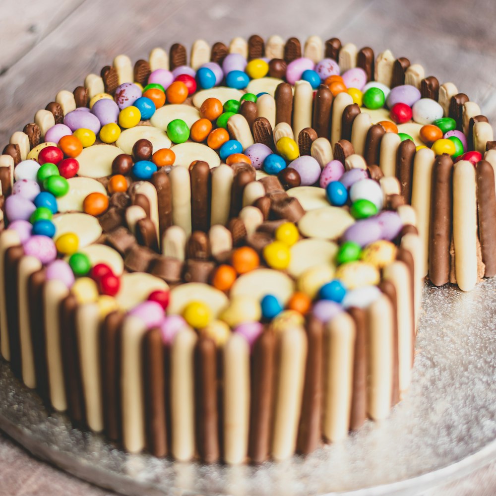 chocolate coated cake with sprinkles on gray concrete surface