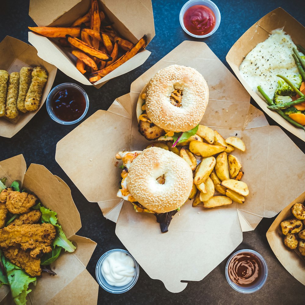 burger and fries on white paper