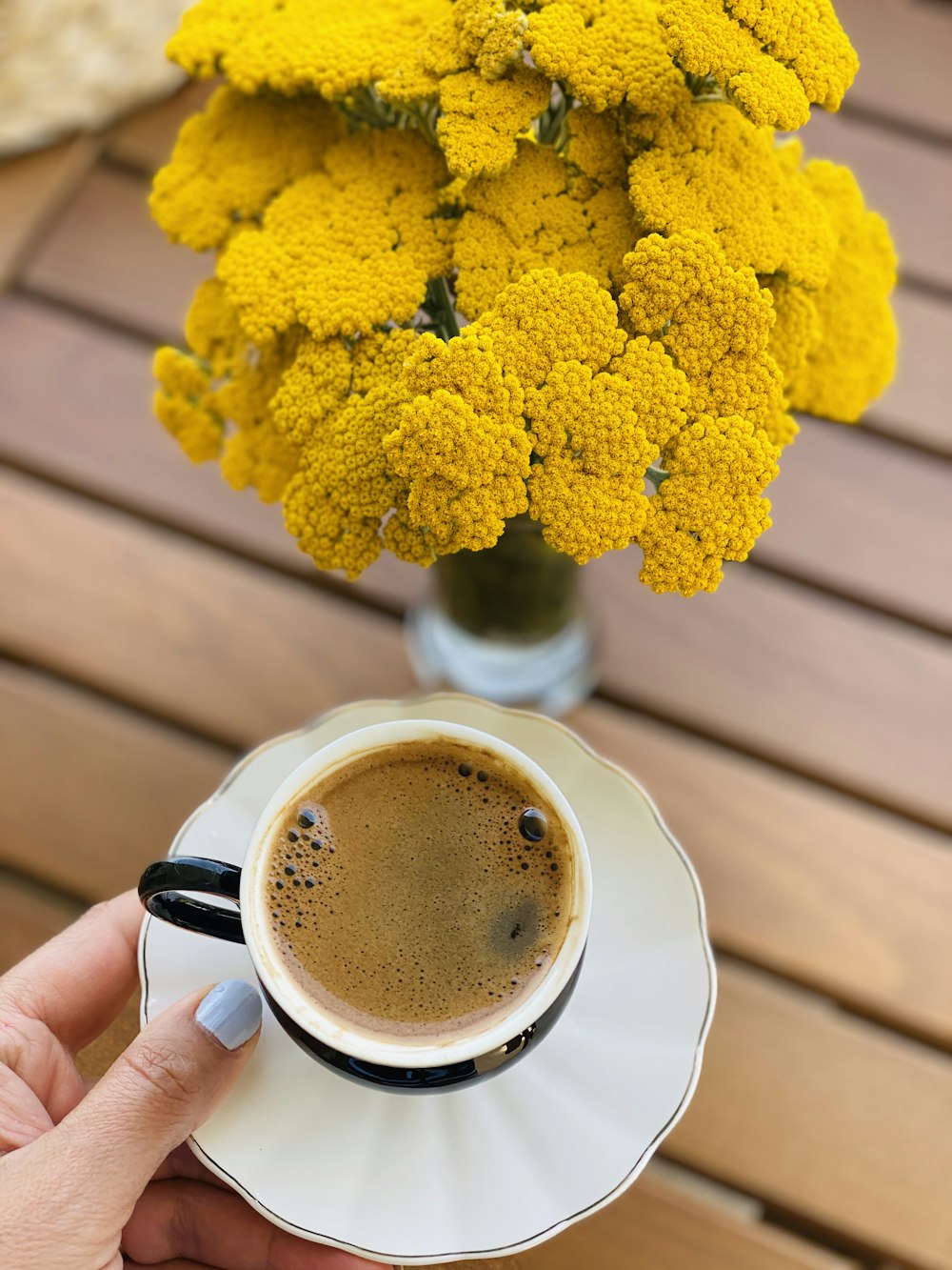 yellow flower on white ceramic mug