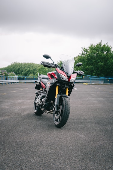 orange and black sports bike on road during daytime
