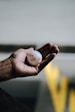 person holding white golf ball