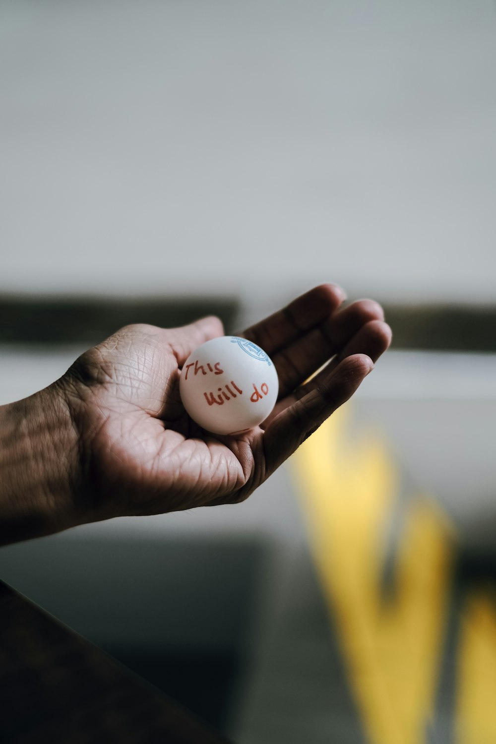 person holding white golf ball