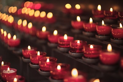 red candles on black steel holder diwali zoom background
