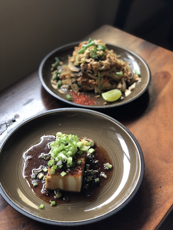 Green vegetable dish on blue ceramic plate