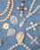 A collection of religious-themed jewelry arranged on a blue denim fabric. The pieces include beaded rosaries, pendants, and medals featuring pearls and gold accents, with some displaying religious icons and symbols.