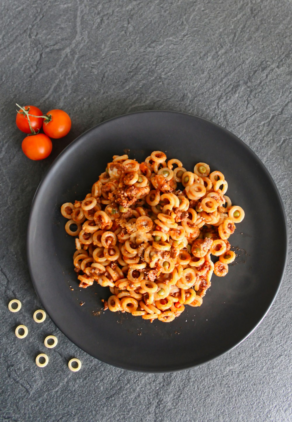 brown pasta on black ceramic plate