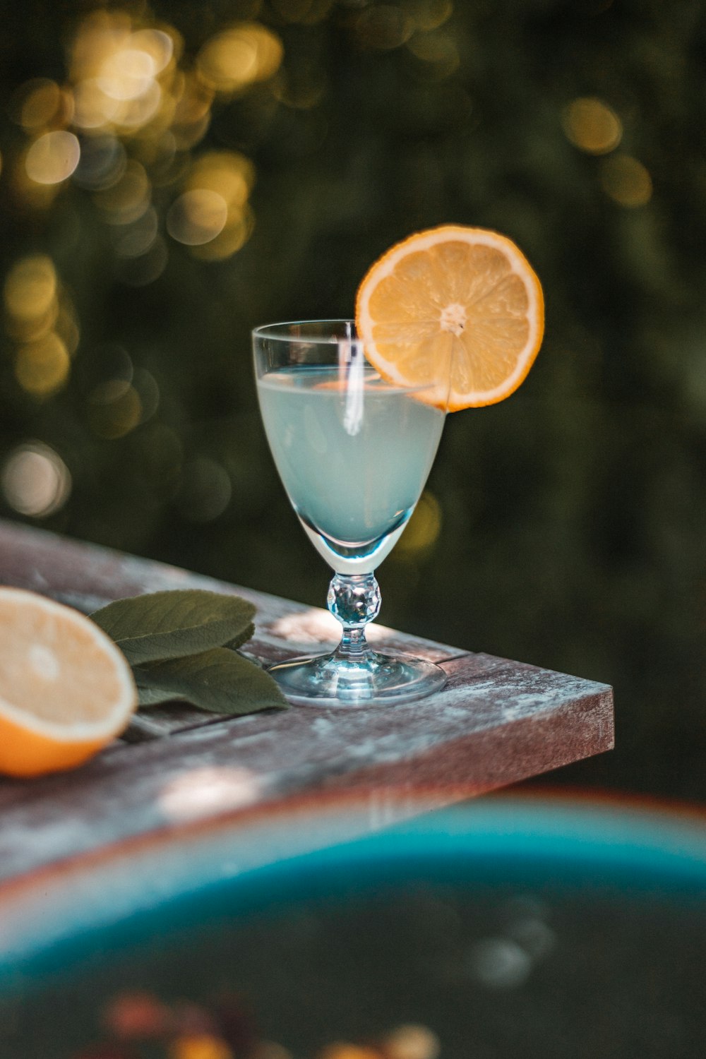 clear wine glass with sliced orange fruit