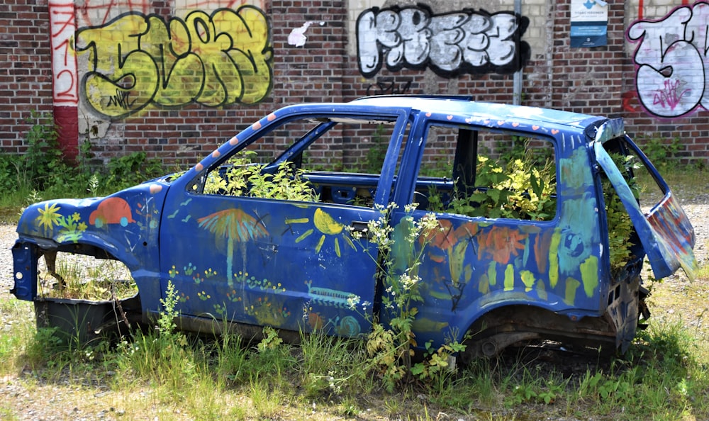 blue and white van with graffiti