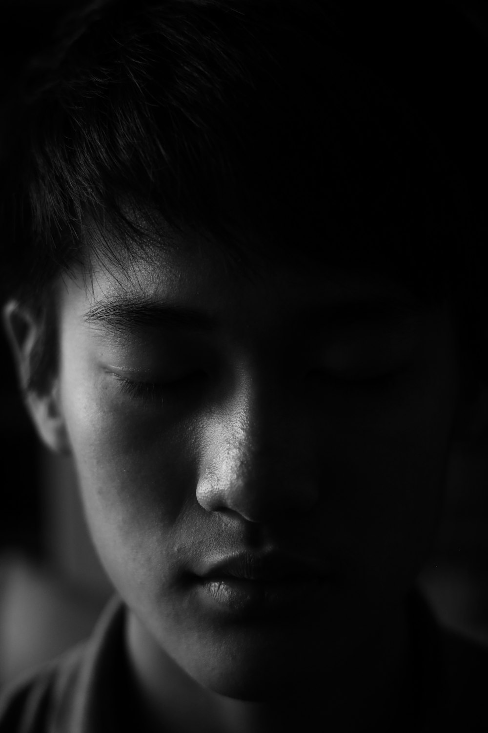 grayscale photo of boys face