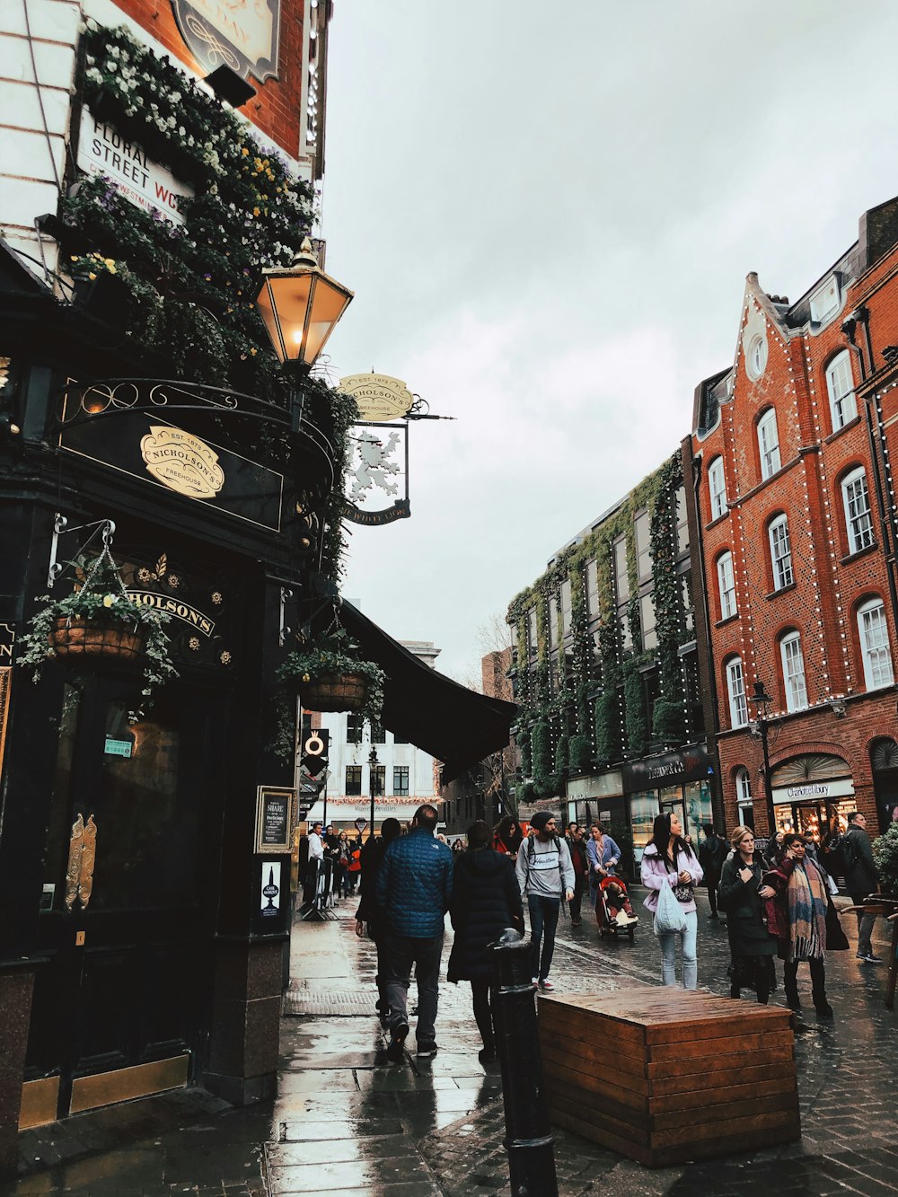 people walking on street near buildings during daytime