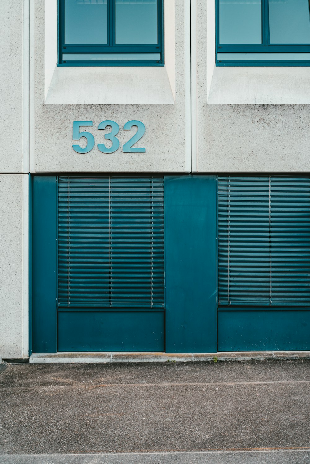 blue wooden door with white number 2