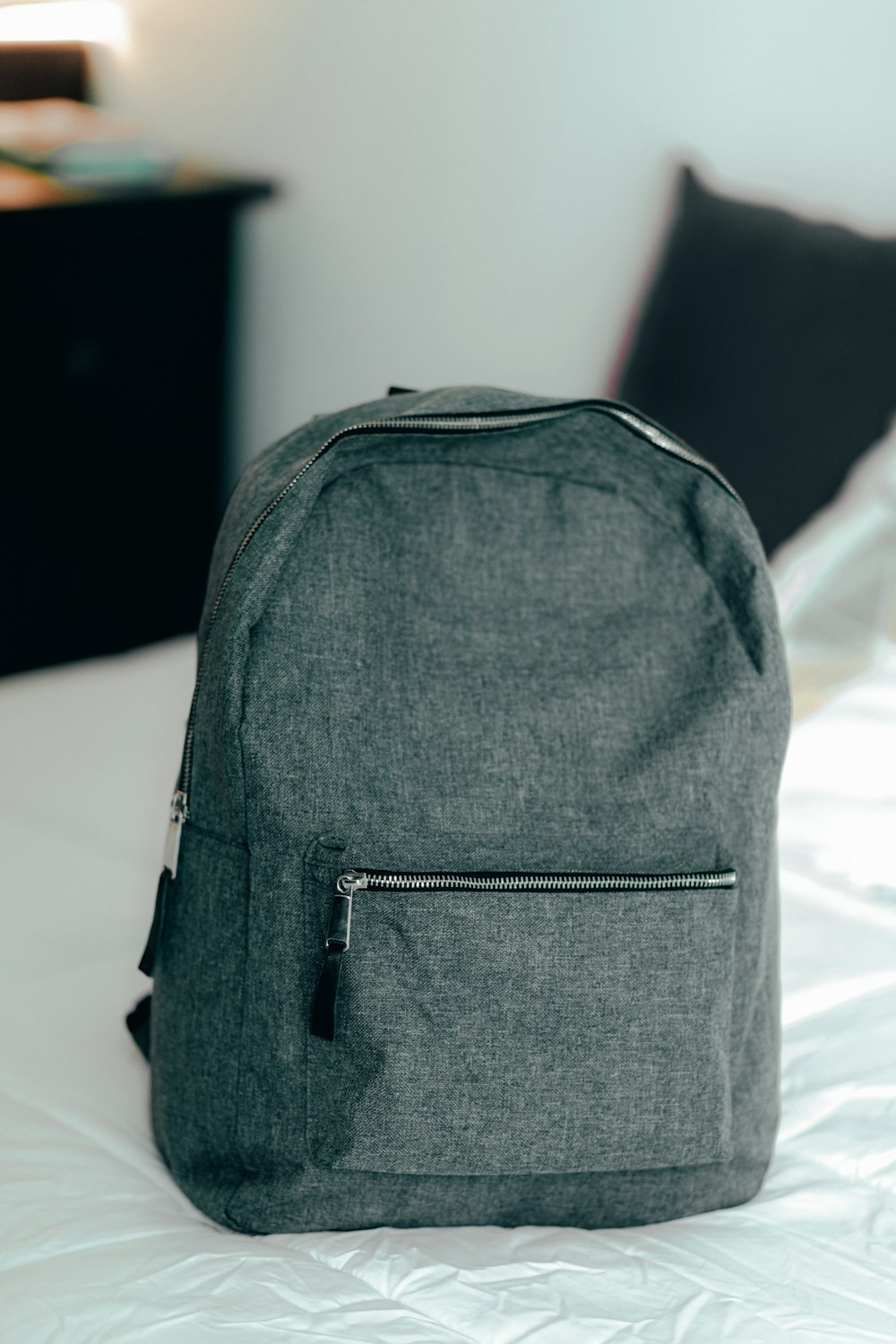 black backpack on white textile