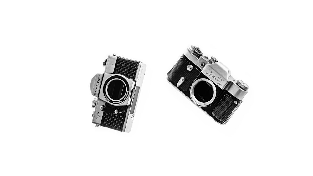 black and silver camera on white surface