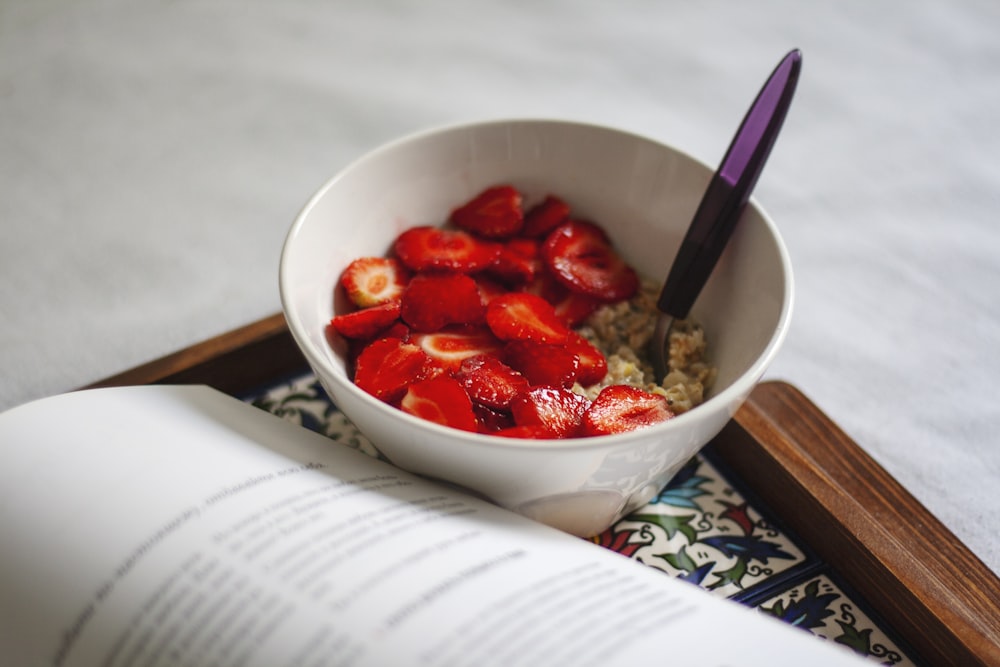 strawberries in white ceramic bowl