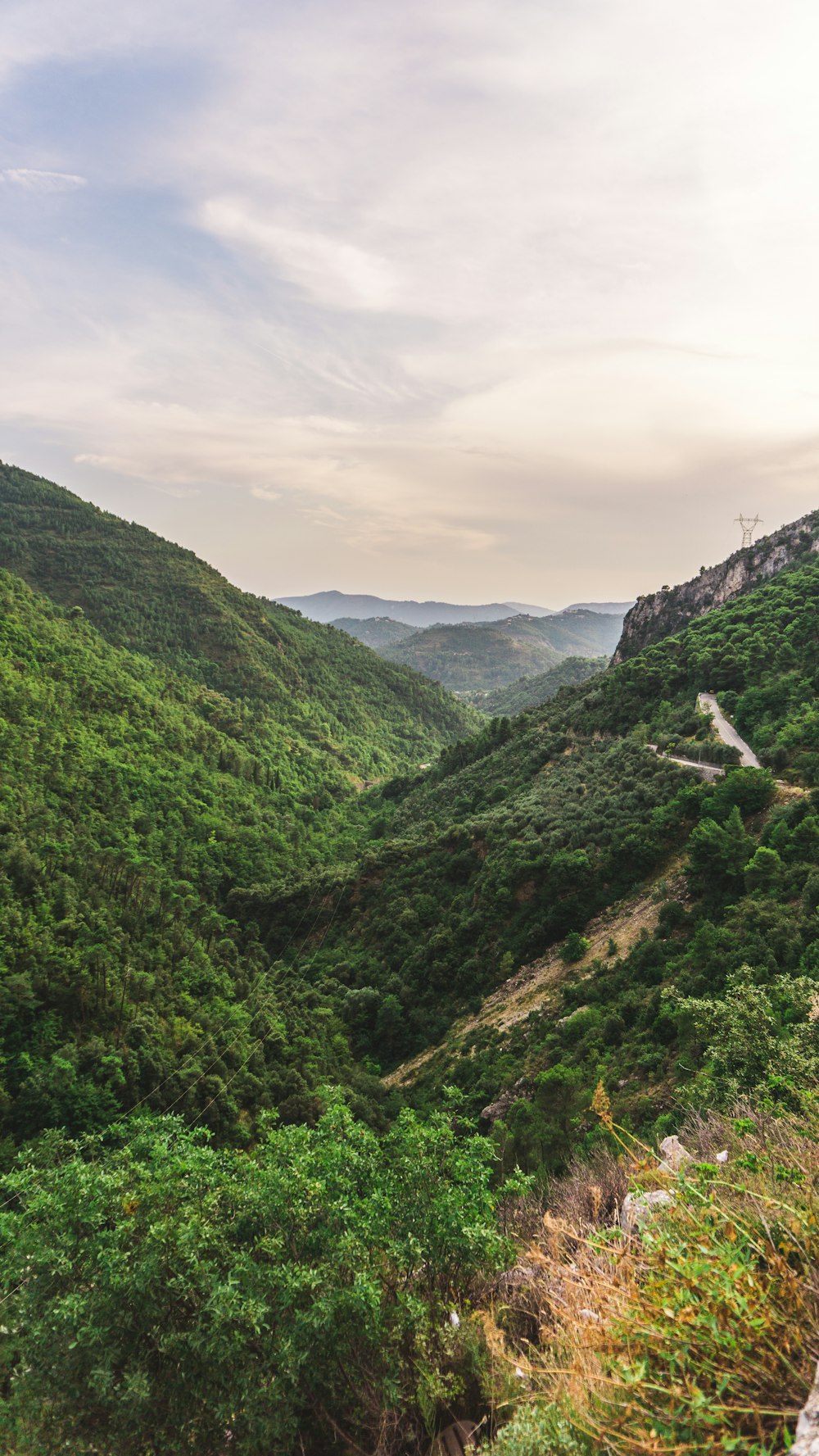 green mountains under white clouds during daytime