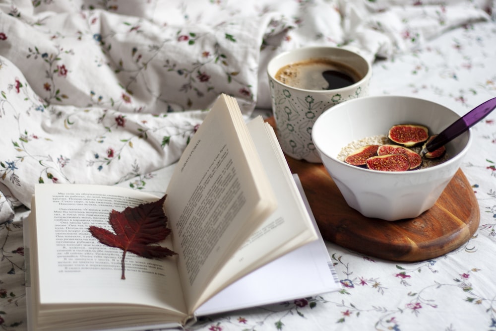 white ceramic bowl on white book page