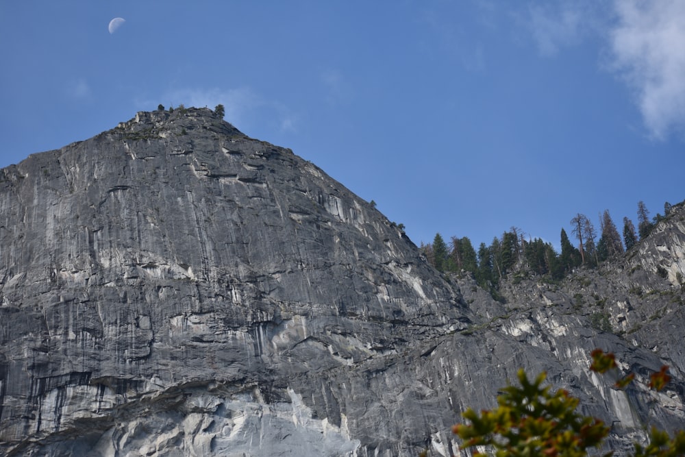 gray rocky mountain under blue sky during daytime