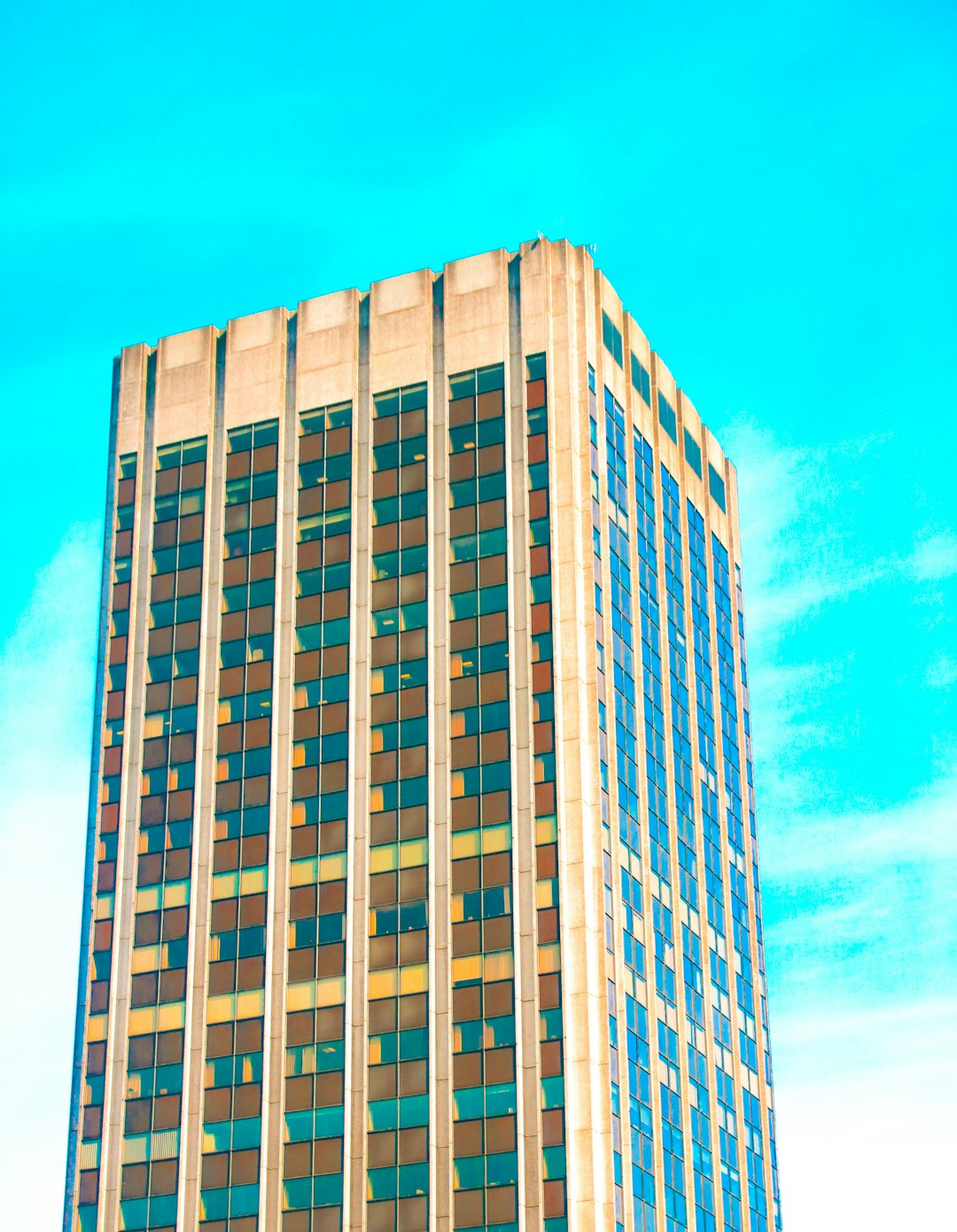 white and blue concrete building under blue sky during daytime