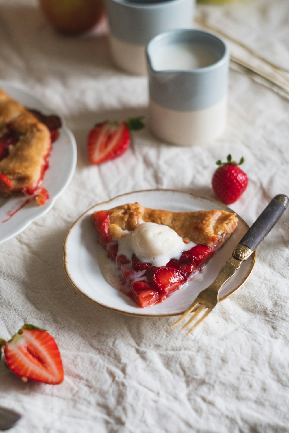 red strawberry on white ceramic plate