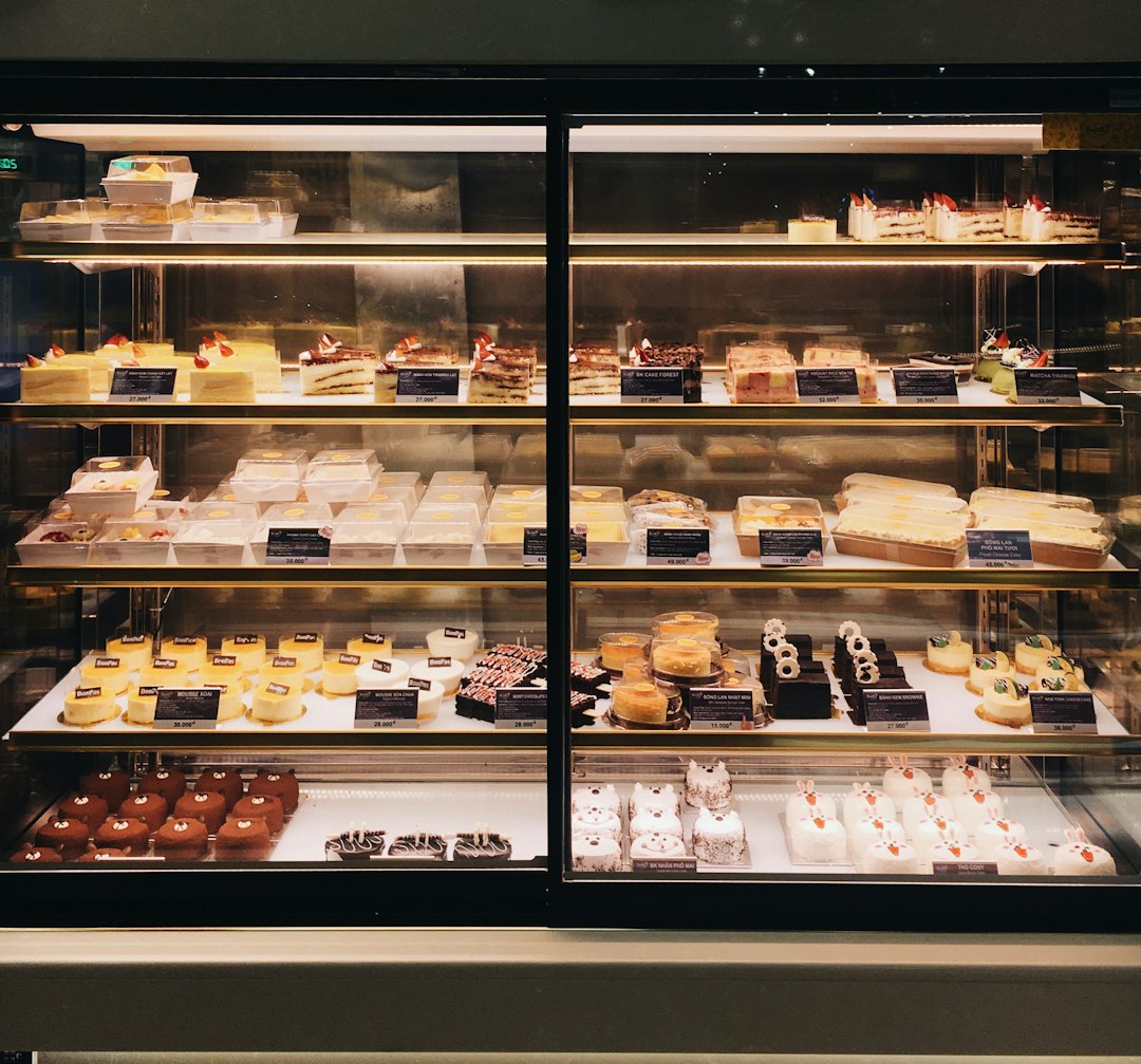 white and brown pastry on display counter