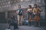 3 women playing musical instruments