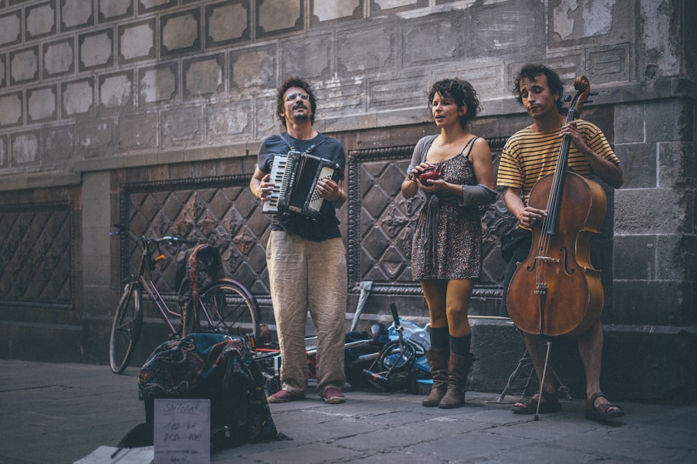 3 women playing musical instruments