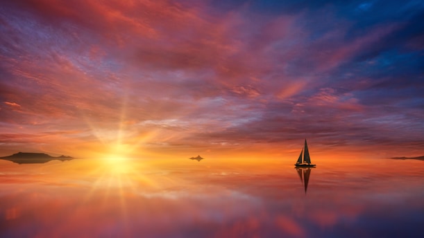 A serene sailing scene at sunset.