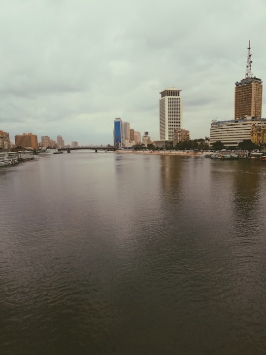 body of water near city buildings during daytime in Cairo Egypt