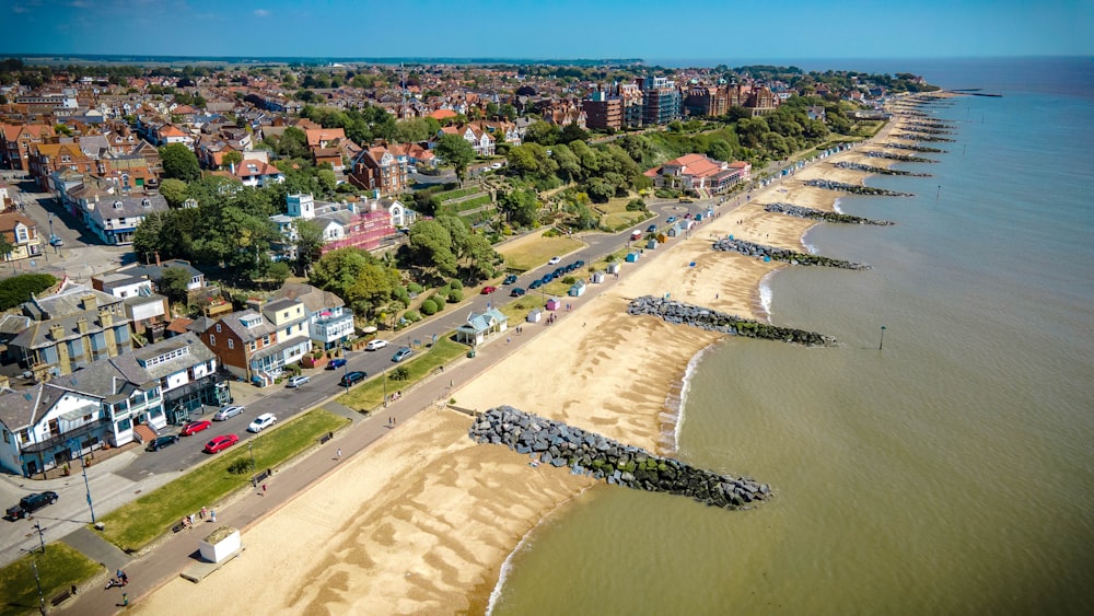 aerial view of city buildings near body of water during daytime