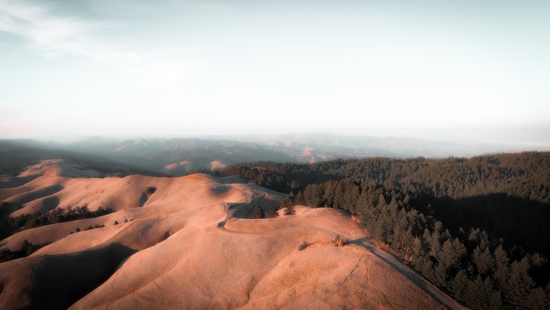 brown rock formation under white sky during daytime