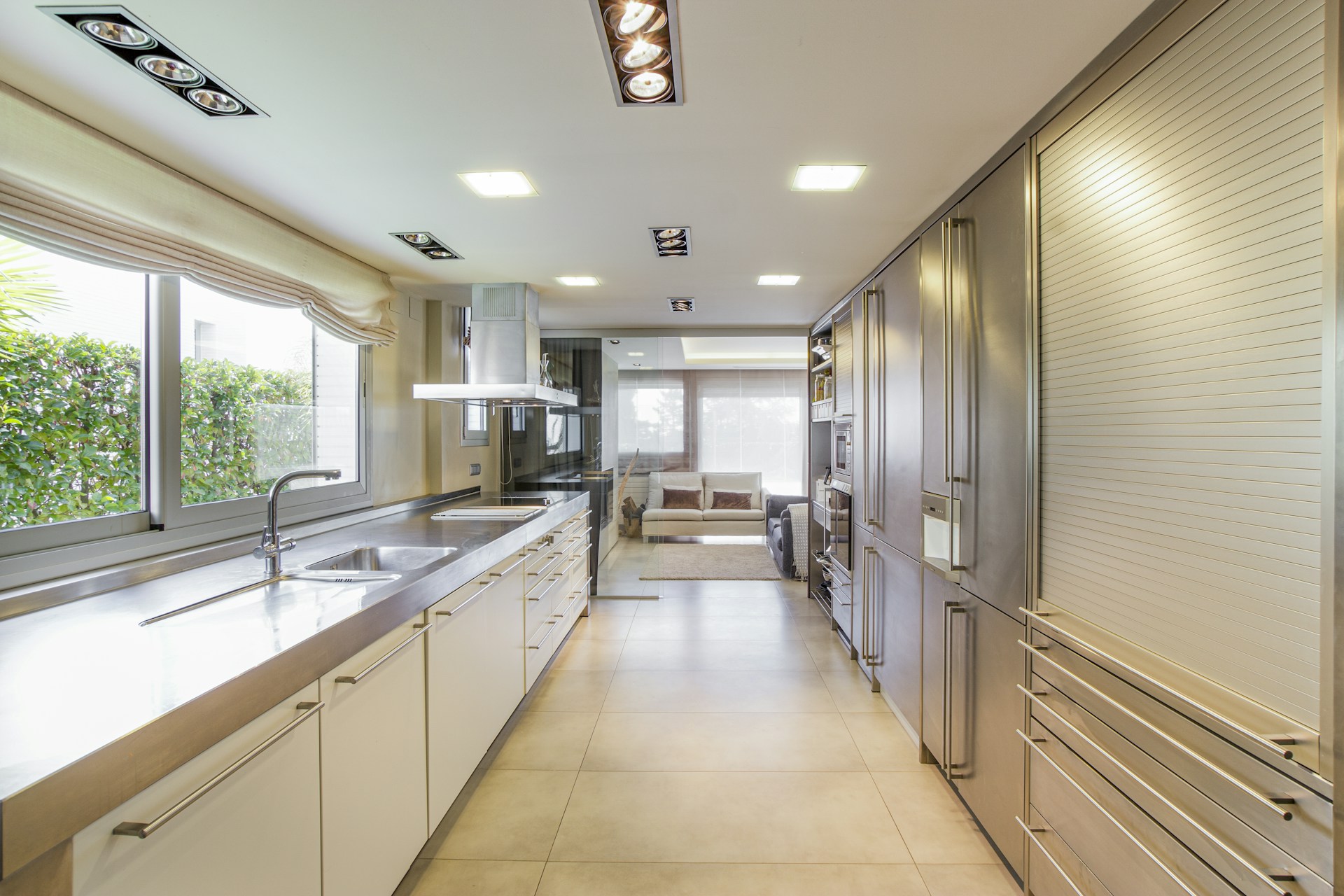 white wooden kitchen cabinet near window