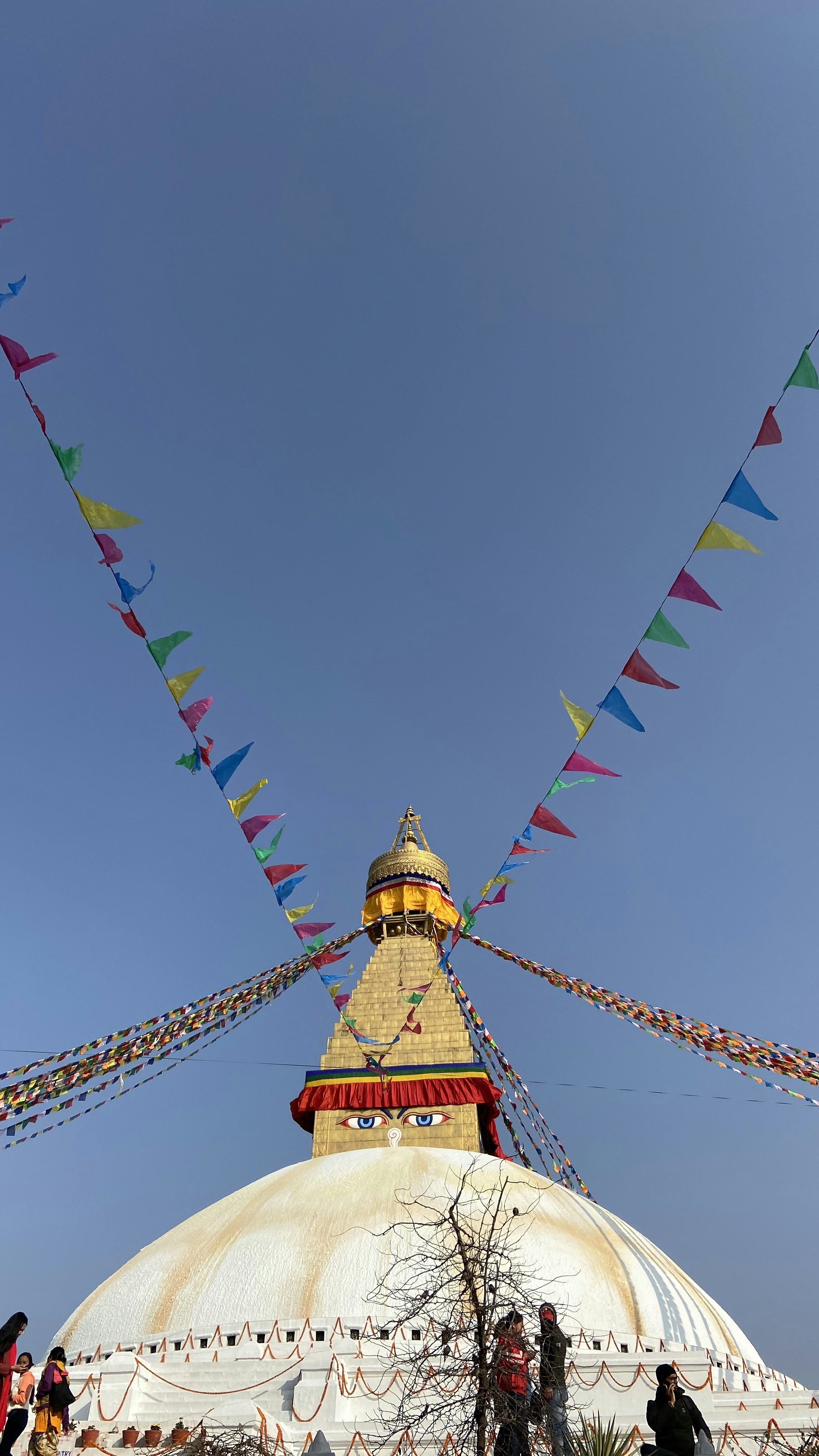 yellow and red tower under blue sky