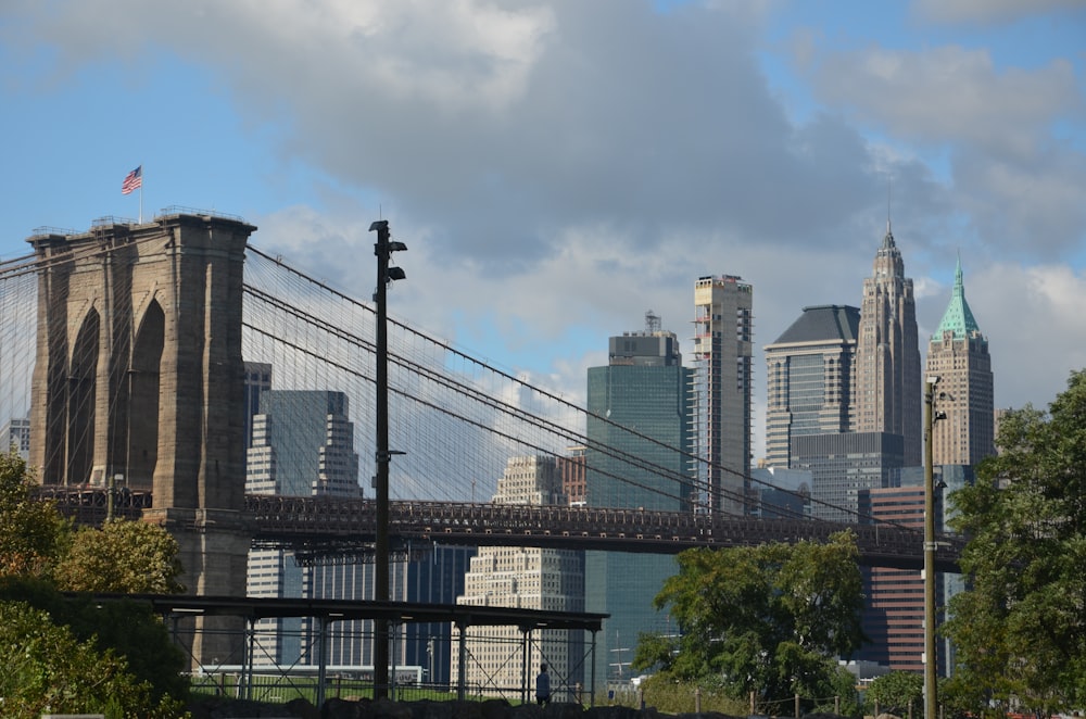 black metal bridge across city buildings during daytime