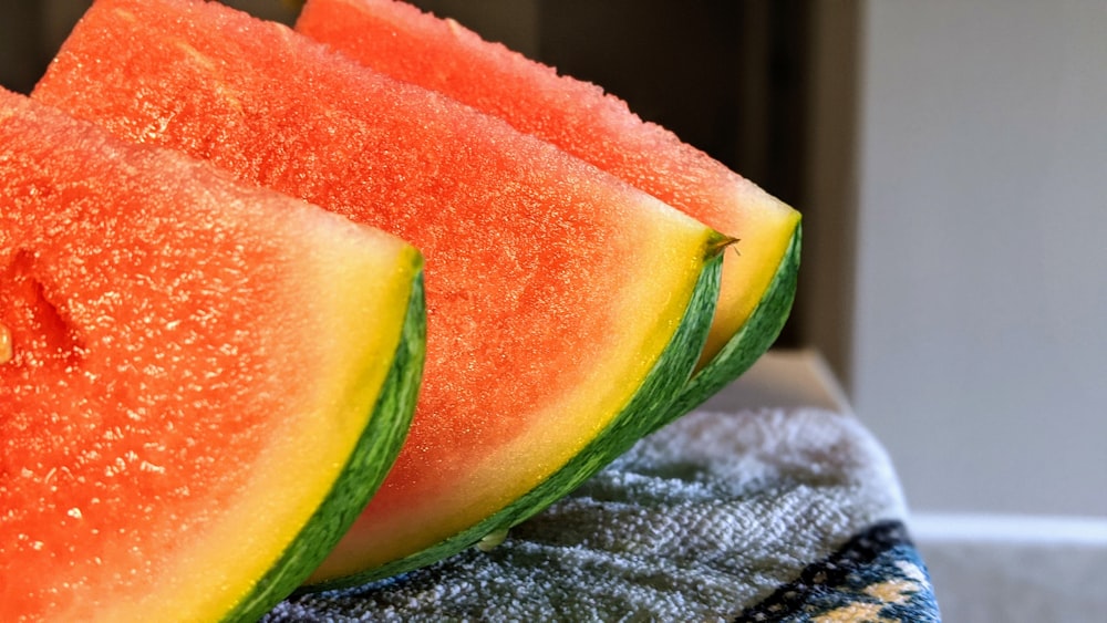 watermelon slices on gray textile