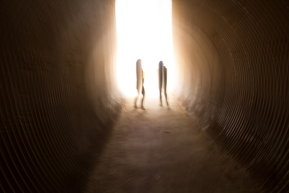 person walking on a tunnel
