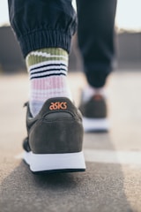 person wearing black and white nike air force 1 low