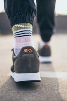 person wearing black and white nike air force 1 low