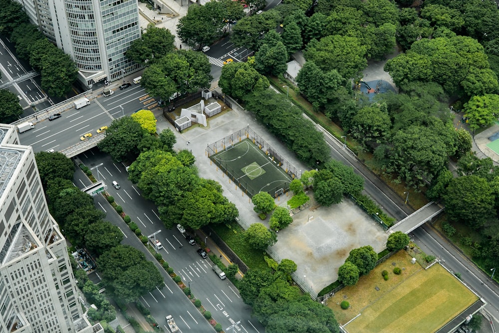 aerial view of city buildings and trees during daytime