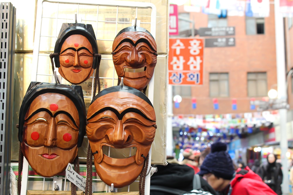 man in black jacket wearing brown mask